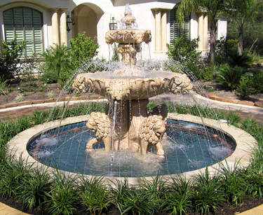 COPPER FINISH RING HIGHLIGHTING CONCRETE FOUNTAIN